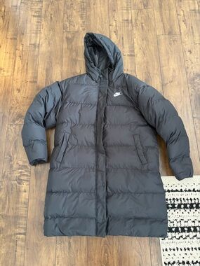 Nike woman’s  Hooded Long Puffer Coat in Black